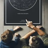 Woman with a dog and a starrymaps.com print on the wall, wide shot.